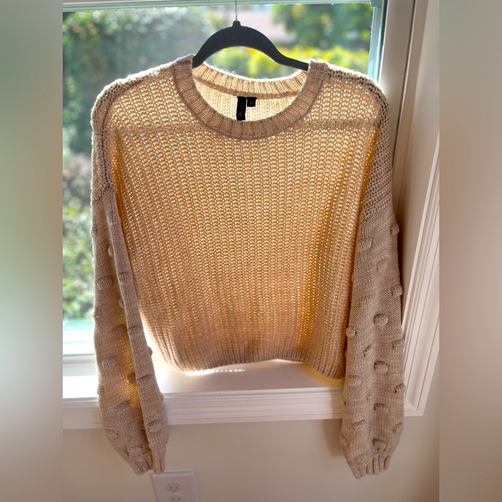 cream colored moon&madison sweater with detailed puffy sleeves